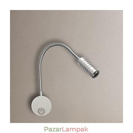 A tömlőágy fejének fali lámpájának fali lámpáját az olvasólámpa világítja meg A tömlőágy fejének fali lámpájának fali lámpáját az olvasólámpa világítja meg