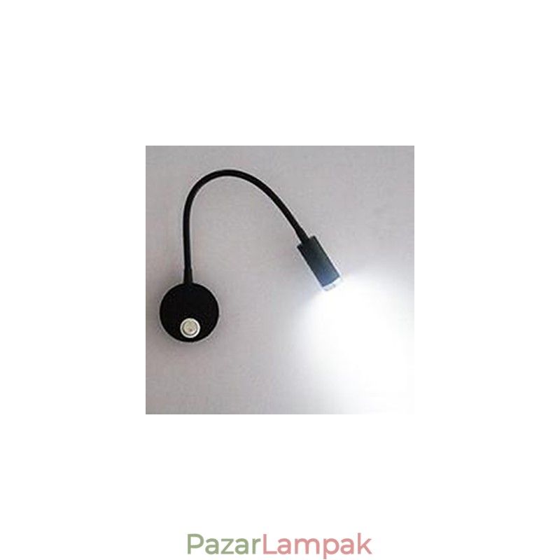 A tömlőágy fejének fali lámpájának fali lámpáját az olvasólámpa világítja meg